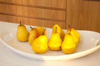 Pears on plate in kitchen 