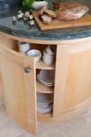Wooden curved cupboard in modern kitchen 