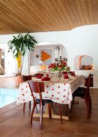 Dining table and chairs by indoor pool