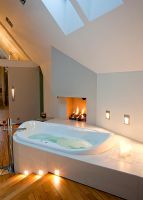 Bath and fire in modern bedroom 