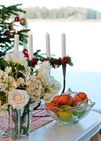 Flowers and candles on dining table