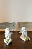 Ceramic cherubs on dining table 