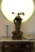 Sculpture lamp on ornate sideboard