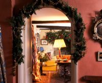 Christmas decorations over doorway arch