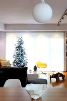 Modern living area with Christmas tree