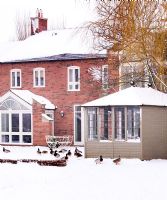 Classic house exterior in snow
