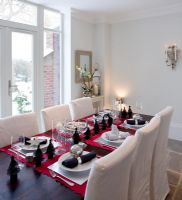 Modern dining room laid for Christmas 