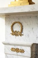 Gold detail on mantelpiece