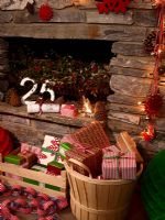 Presents by rustic stone fireplace