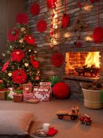 Christmas tree by stone fireplace