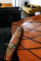 Decorated skateboard on feature wall 