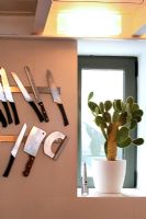 Wall mounted knife rack in modern kitchen 