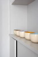 Matching bowls on shelf detail