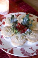 Mince pies on red and white plate 