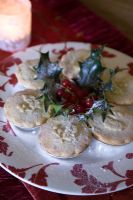 Mince pies on red and white plate detail