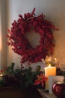 Red Christmas wreath and candles