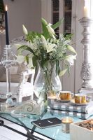 White lilies on modern coffee table 