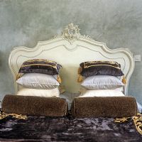Ornate headboard and cushions detail 