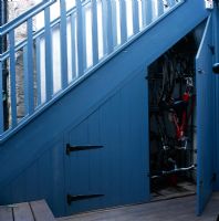 Bikes stored under exterior staircase 