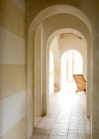 Corridor of arched doorways