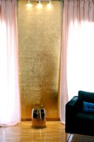 Gold living room wall and lighting 