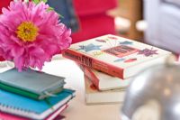 Flowers and books on coffee table detail