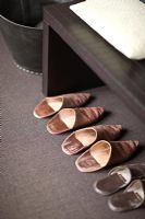 Leather slippers in modern bedroom detail 