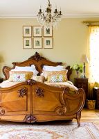 Classic bedroom with carved wooden bed