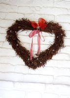 Wall mounted heart shaped wreath detail 
