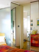 Modern bedroom with mirrored doors 