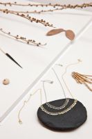 Jewelery laid out in modern workshop detail 