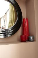 Shelf and mirror in modern bedroom 