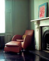 Vintage chair and footstool in living room  