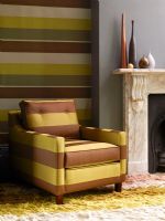 Modern stripey armchair and feature wall 