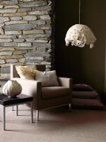 Modern living room with exposed stone wall