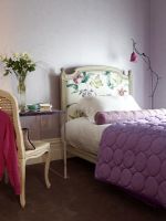 Feminine bedroom with floral headboard 
