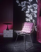 Metal chair and soft furnishings detail 