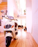 Scooter parked in modern hallway 
