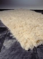 Sheepskin rug on slate floor, detail 