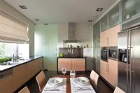 Modern kitchen with dining table 