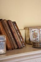 Collection of leather bound books on shelf