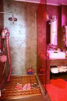 Shower with red glass cubicle