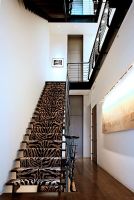 Modern staircase with animal print carpet