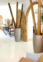Modern hallway with huge vases of bamboo