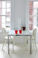 Table and chairs in modern white kitchen 