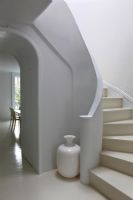 Modern white curved staircase 