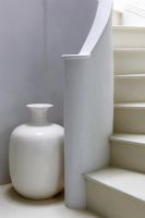 Detail of white curved staircase 