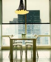 Dining table by window with view of Manhattan