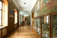 Grand corridor with murals and display cases