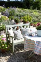 Classic garden furniture on sunny terrace